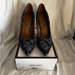 Nine West dark denim flowered 4 inch pumps.
